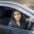 Attractive business woman driving her car