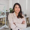Portrait of Asian Business woman with Arms Crossed and standing at modern workplace, human resource and small business owner, hiring new employee, business person concept