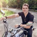vecteezy_young-attractive-man-poses-with-motorcycle_1223963